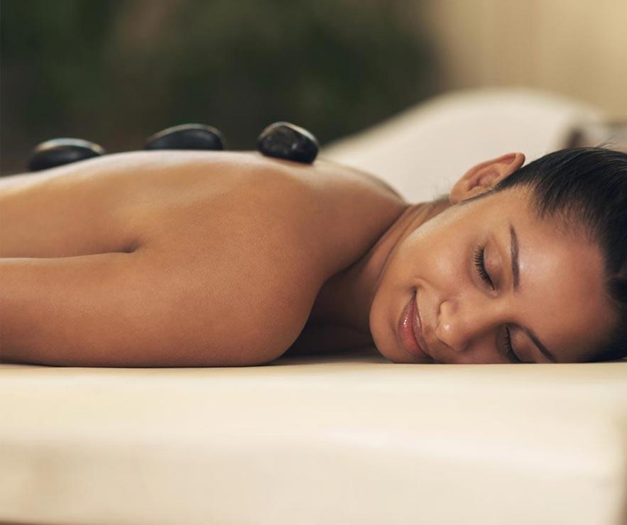 Mangrove Spa Nassau Bahamas - A woman getting a hot rock treatment at the spa
